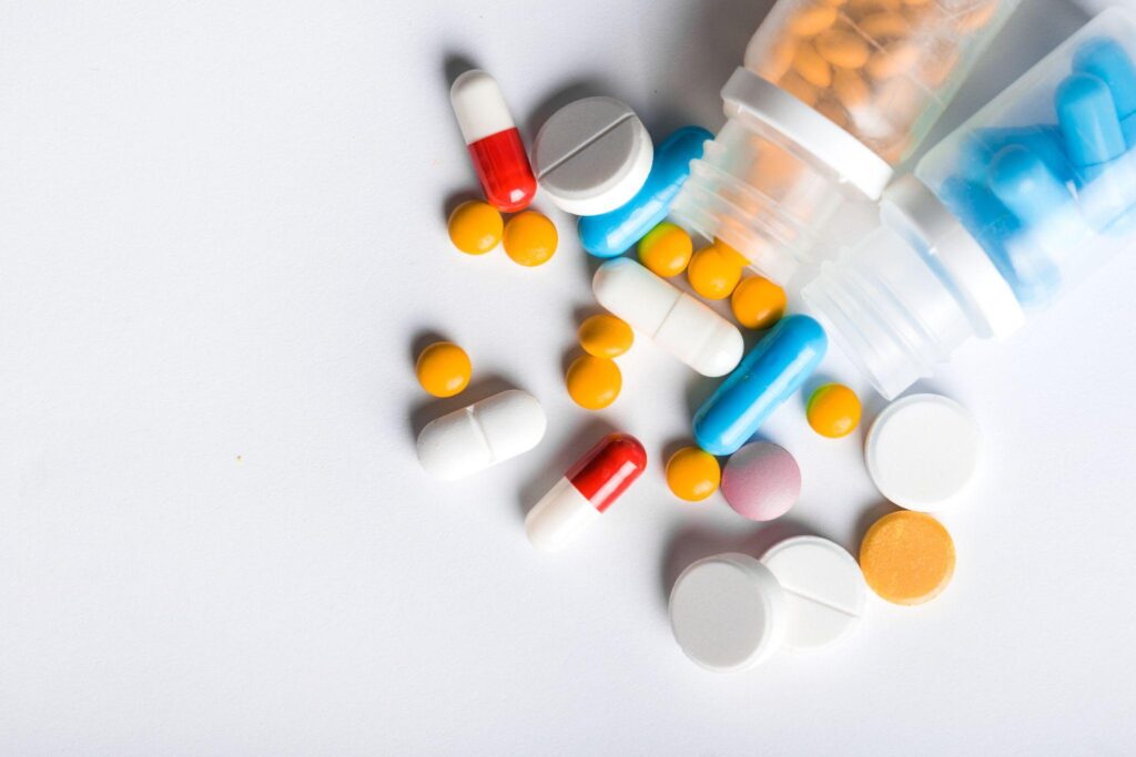 assorted pharmaceutical medicine pills tablets and capsules