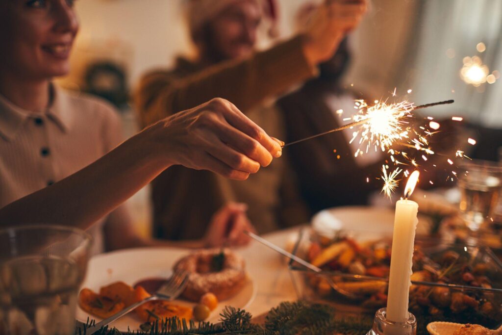 close up of hand holding sparkler