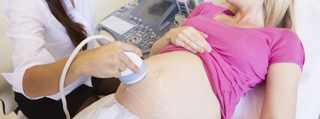 Doctor Examining Pregnant Woman