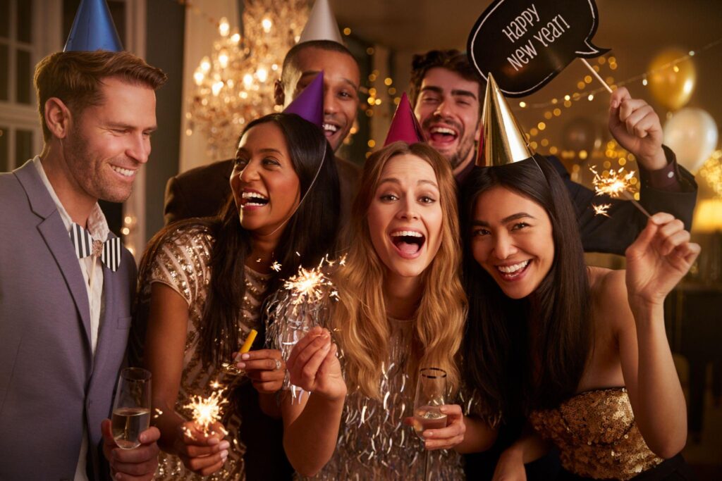 group of friends celebrating at new year party together
