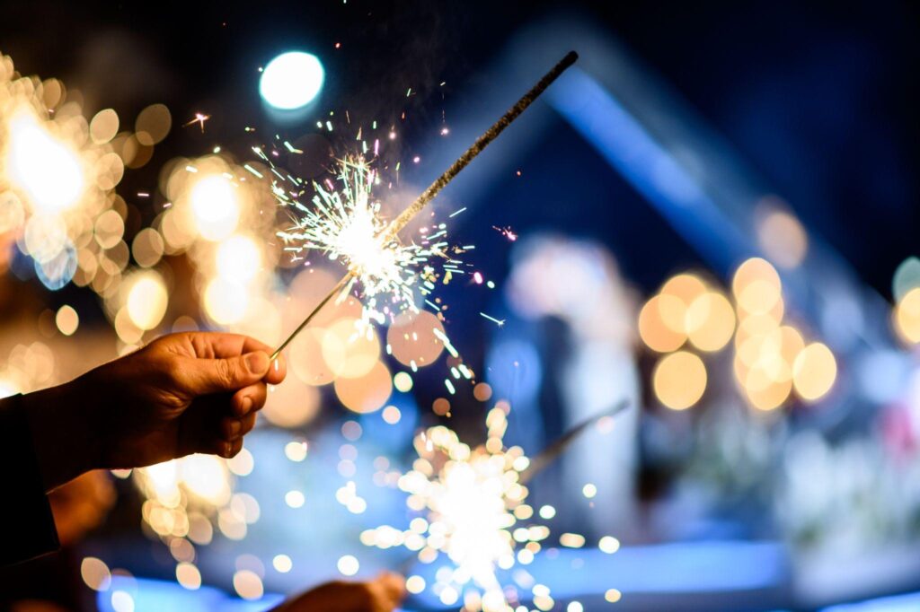 man hand holding a burning sparkler