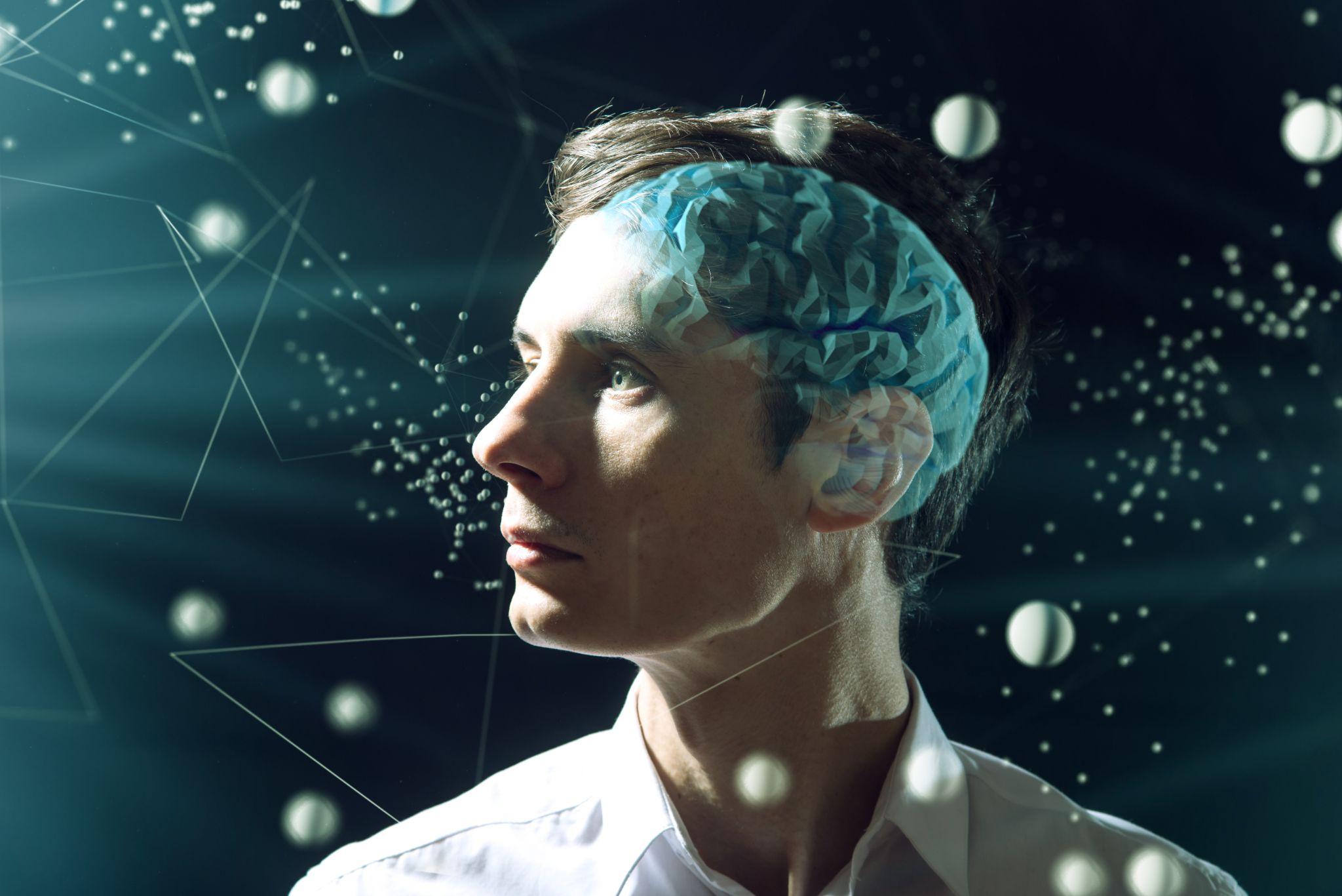 The man's head businessman with digital brain and the grid connections of neurons