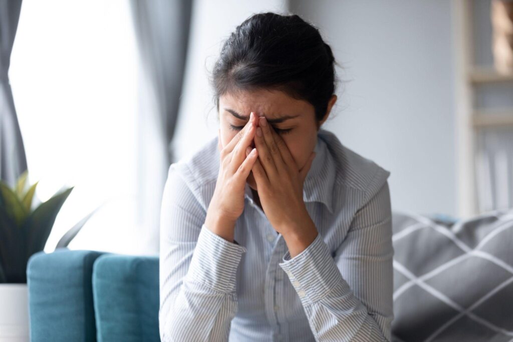 woman experiencing emotional pain and stress related to alcohol use disorder
